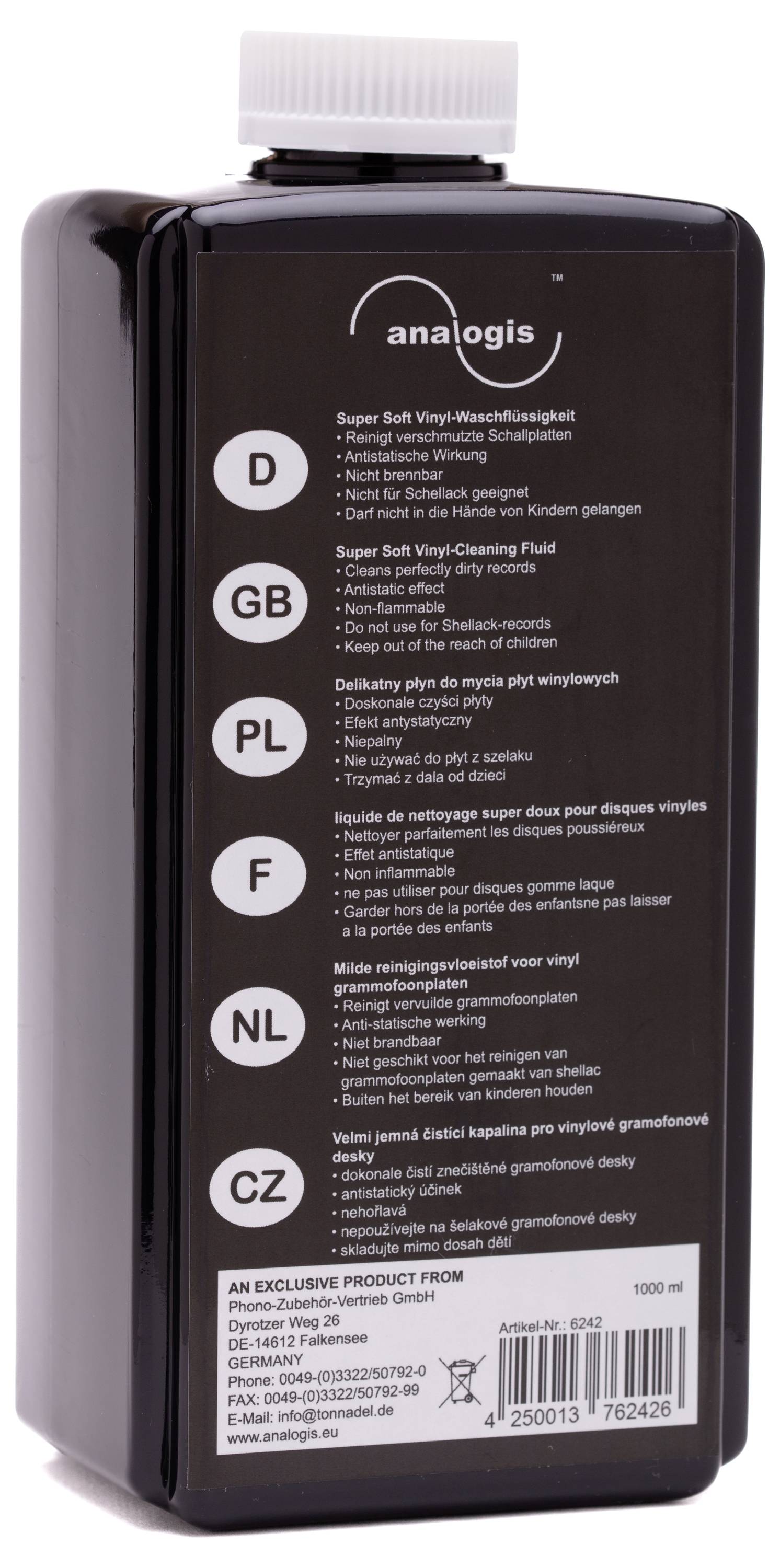 The image shows a black bottle with a white, multilingual product description and a logo at the top.