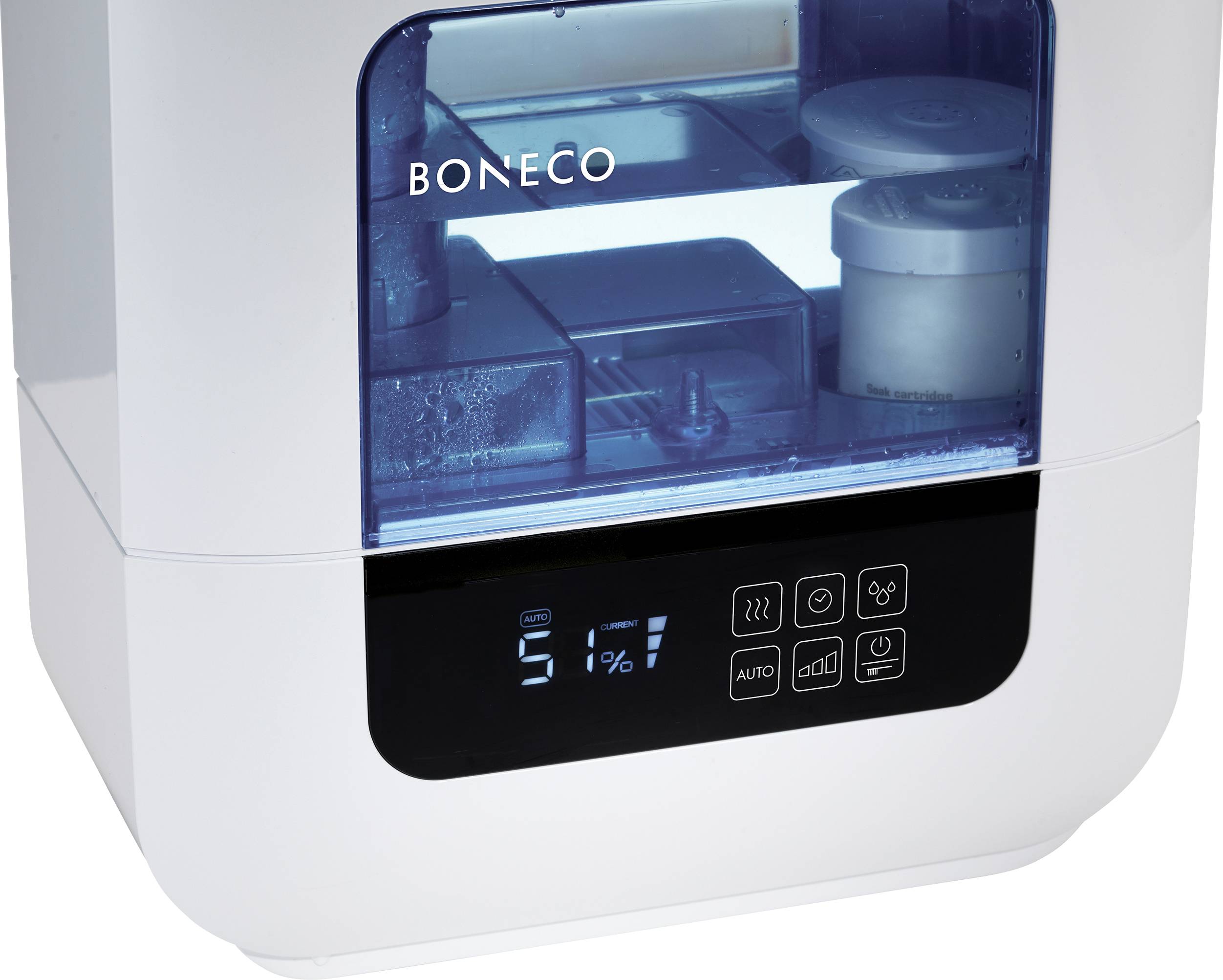 A humidifier with a digital display is showing 51% humidity. Various control buttons are visible.