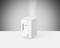 A white Boneco humidifier emitting steam sits on a white surface against a grey background.