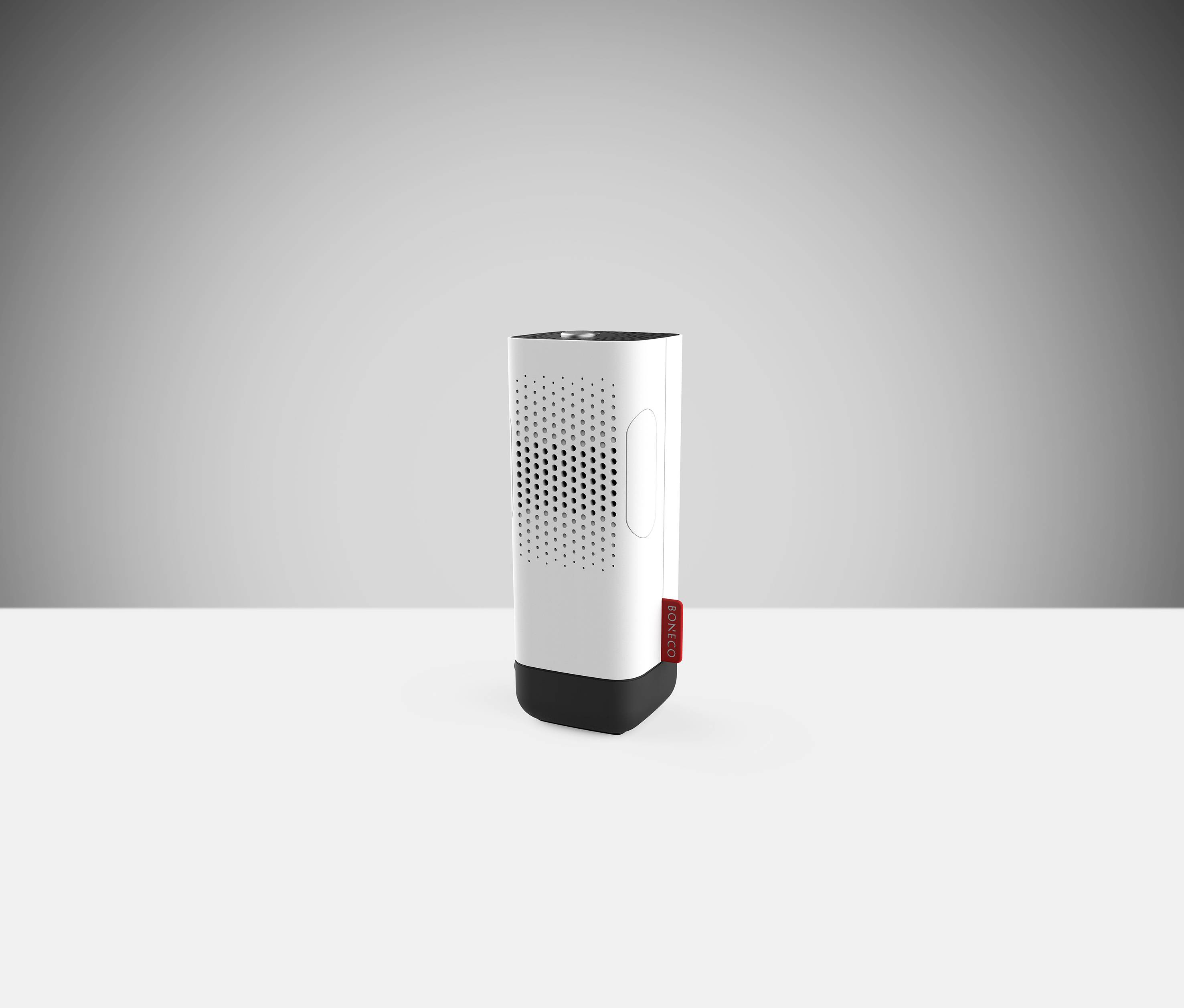 White portable speaker box with a black base; red marking on the side; positioned on a light background.