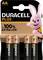 Four AA Duracell Plus batteries, packaged. A figure of a smiling pink rabbit in sportswear is depicted on the packaging.
