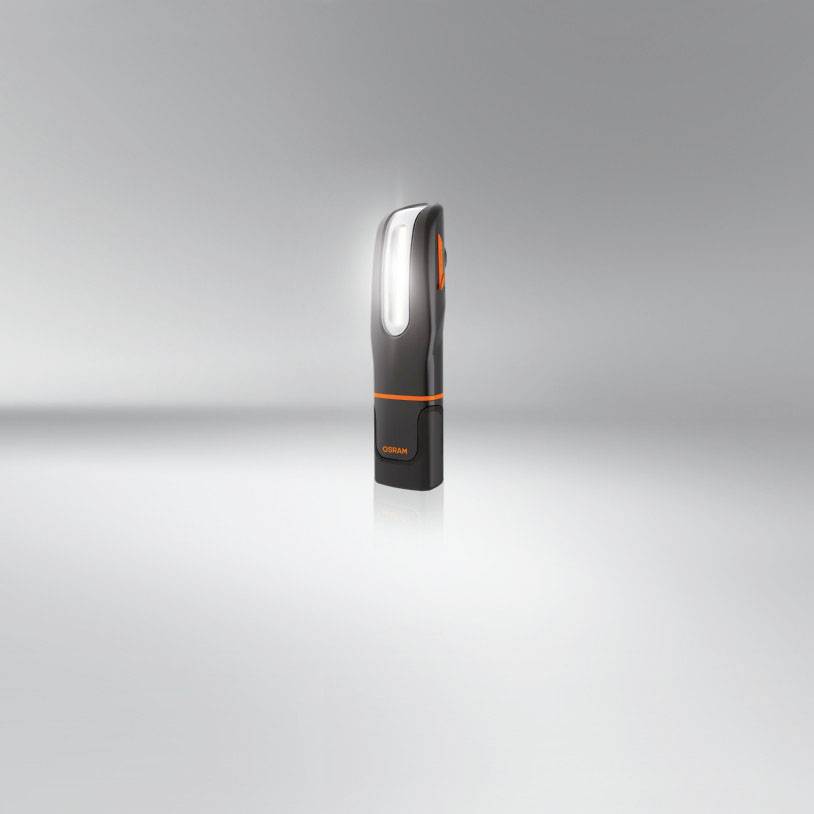 Grey and black electric razor with orange accents against a grey background.