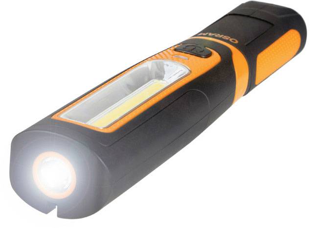 A black and orange torch is shining. It has a button and a long, bright light strip on the side.