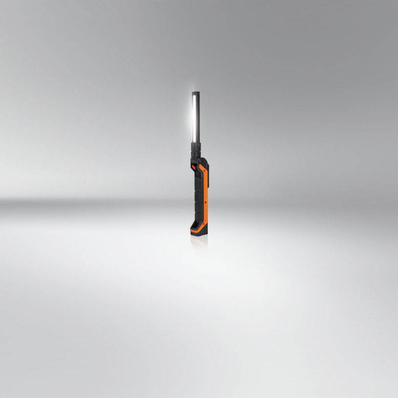 Portable LED work light with a sleek, black design and orange accents.