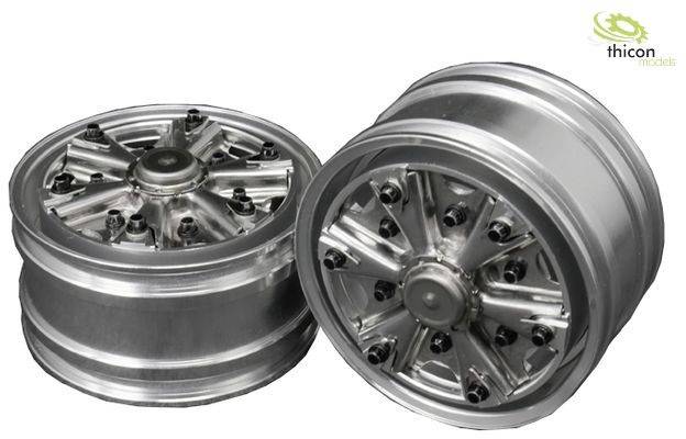 Two silver model vehicle rims with detailed spokes and hubs, produced by 'Thicon Models'.