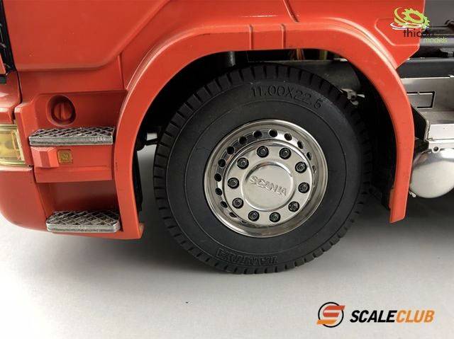 'Close-up of a model lorry tyre. The tyre has a size of 11.00x22.5. Logo: ScaleClub.'