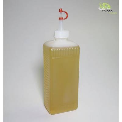 Plastic bottle with a red spout and yellowish-brown liquid, standing against a grey background.