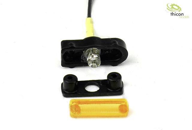 Small electronic component with a black casing and orange cover piece. 'thicon models' brand visible in the top right.