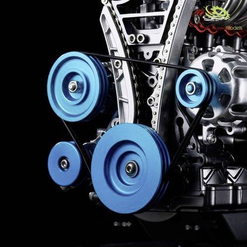 Close-up of an engine block system with blue pulleys and black belts. Essential mechanical details visible.