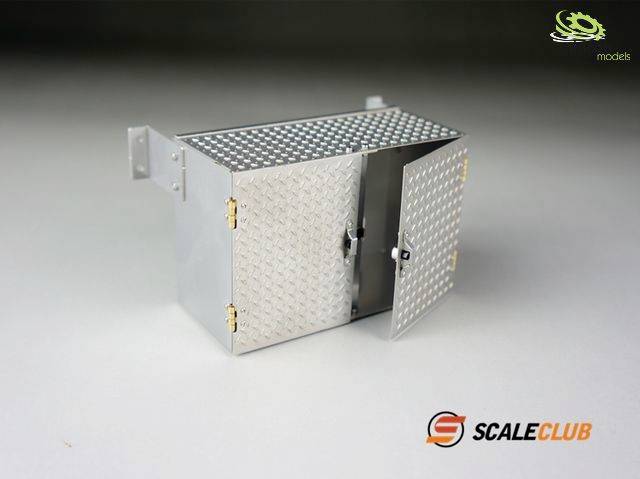 Metal cabinet with a diamond-patterned design, two open doors with gold-coloured hinges, positioned on a grey surface. 'Scale Club' logo in the bottom right corner.