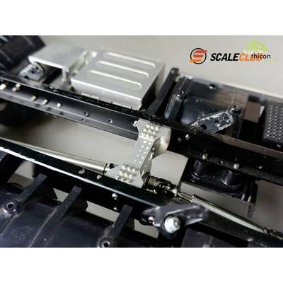 Close-up of a model vehicle chassis with metal and plastic components. Logos for 'Scaleclub' and 'Techicon' are visible at the top.