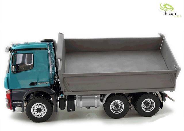 'Lorry model viewed from above, green-black with grey cargo area. Six wheels, suitable for construction or transport models. Logo positioned top right.'