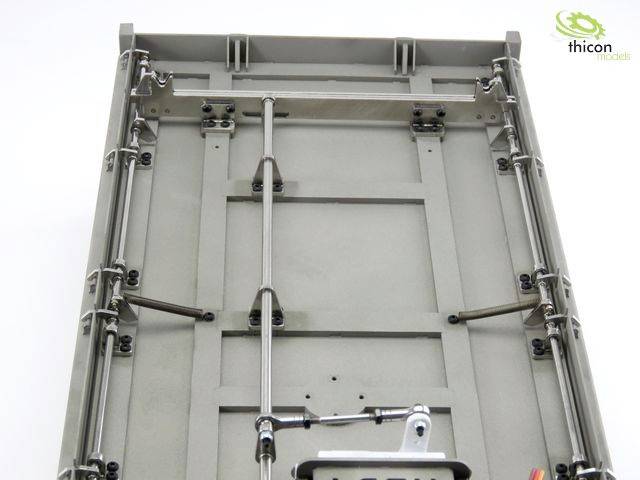 'Underside of a model vehicle with detailed metal construction and suspension. Thicon Models logo located in the top right.'