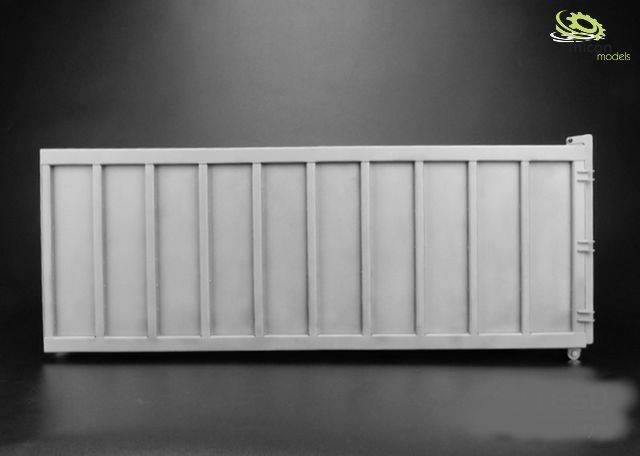 Grey model container against a black background, with logo visible in the top right corner.