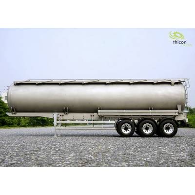 Silver tanker trailer on a gravel yard, green trees in the background. Thicon models logo in the top right corner.