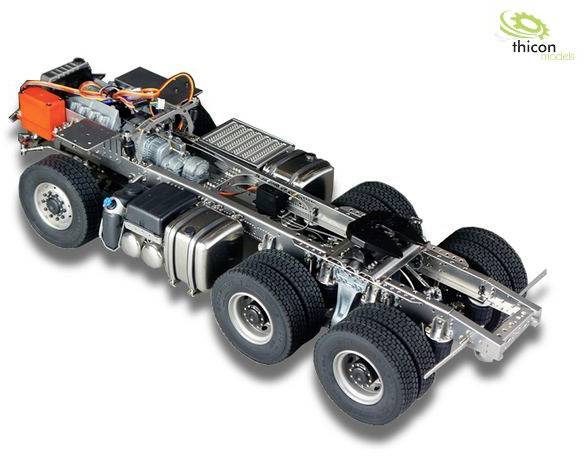 Six-axle model vehicle with complex technical details, including engine and cable structures, depicted on a white background.