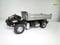 Toy truck model with tipper body on white background. Displays mechanical details and structural composition, suitable for model-building enthusiasts.