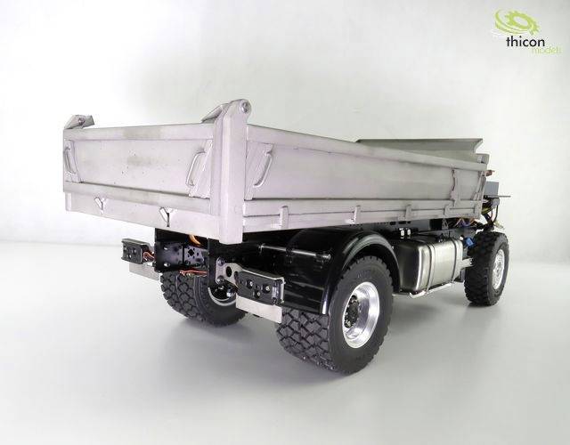 Tipper lorry model from behind, detailed view of loading area and wheels, 'thicon models' logo in the top right corner.