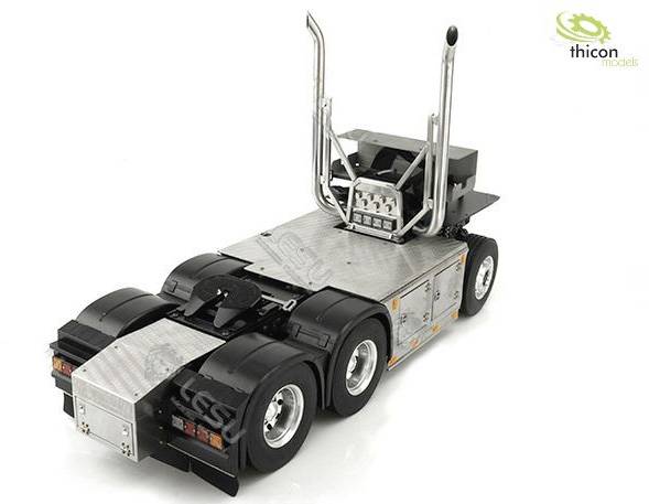 A detailed model of a lorry chassis with stainless steel embellishments and distinctive exhaust pipes; the 'thicon models' logo is visible.