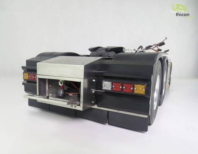 Model truck rear view with realistic tail lights and detailed bumper, shown on a white background.