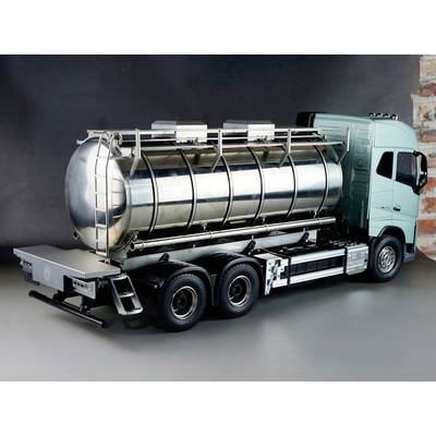 Silver tanker lorry on a grey background, ready for liquid transportation. It has six wheels and a turquoise driver's cab.
