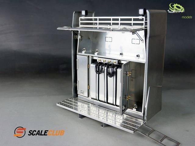 Metal tool rack with an open door. Visible shelves and cables. 'ScaleClub' brand logo in the bottom left.