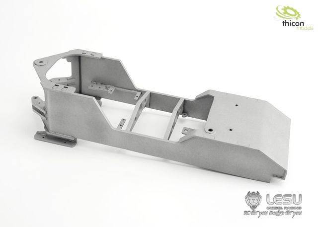 Metal frame of a model vehicle against a white background. Logos are visible in the top right and bottom right corners.