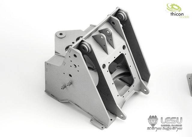 Metal component with a complex structure, comprising multiple surfaces, edges, and fastening elements, against a white background.