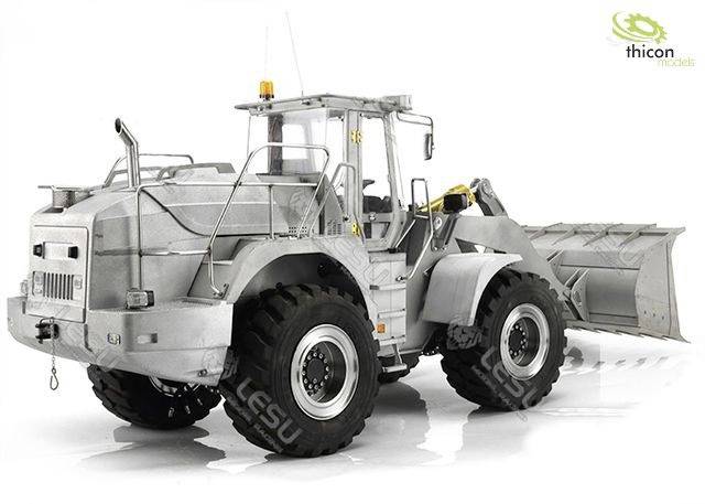 A large excavator with wide tyres and a shovel, on a white background. The 'thicon models' logo is located in the top left corner.