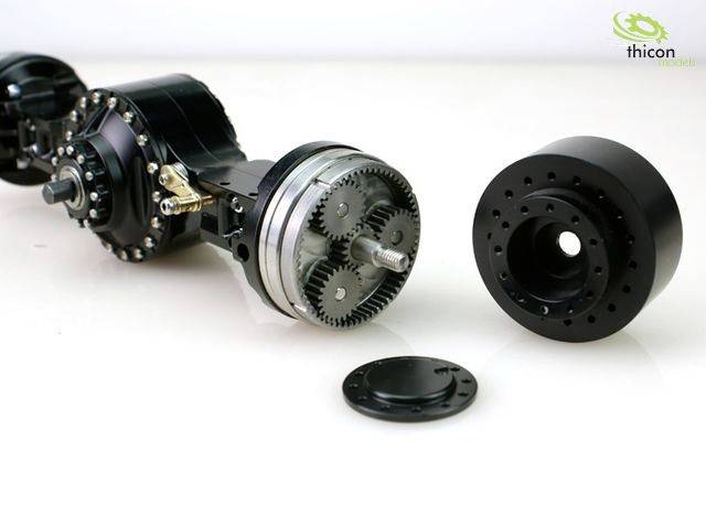 A dismantled gearbox with visible gears and axle components lies on a white background. The Thicon Models logo is positioned in the top right corner.