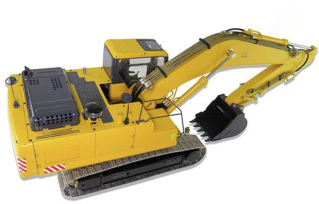 Yellow excavator with a black grab mounted on tracked chassis, ready for earthworks.