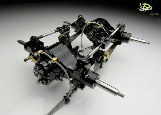 A model of a vehicle's drivetrain with visible gears and axles, depicted against a white background.