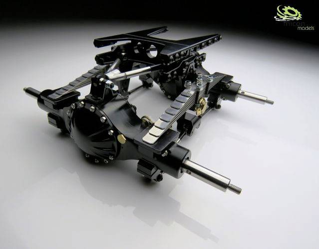 A detailed model of an axle system on a white surface. It displays complex metal parts and mechanisms in black and silver.