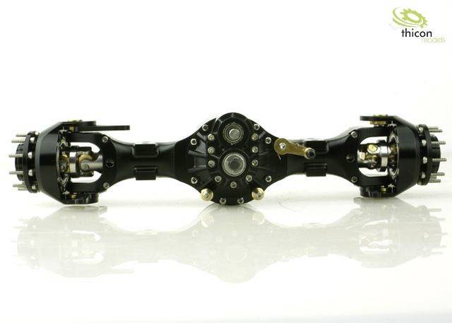 Black axle of a model vehicle on a white background, central gearbox clearly visible, side wheel suspension.
