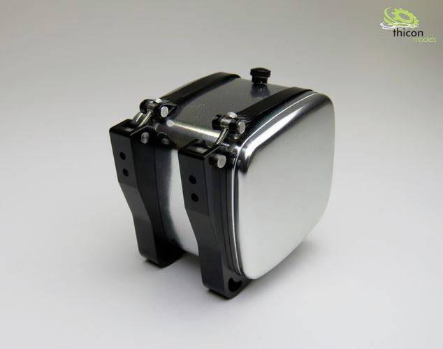 A silver, rectangular object with rounded corners and a black band. It has a small, round valve on top.