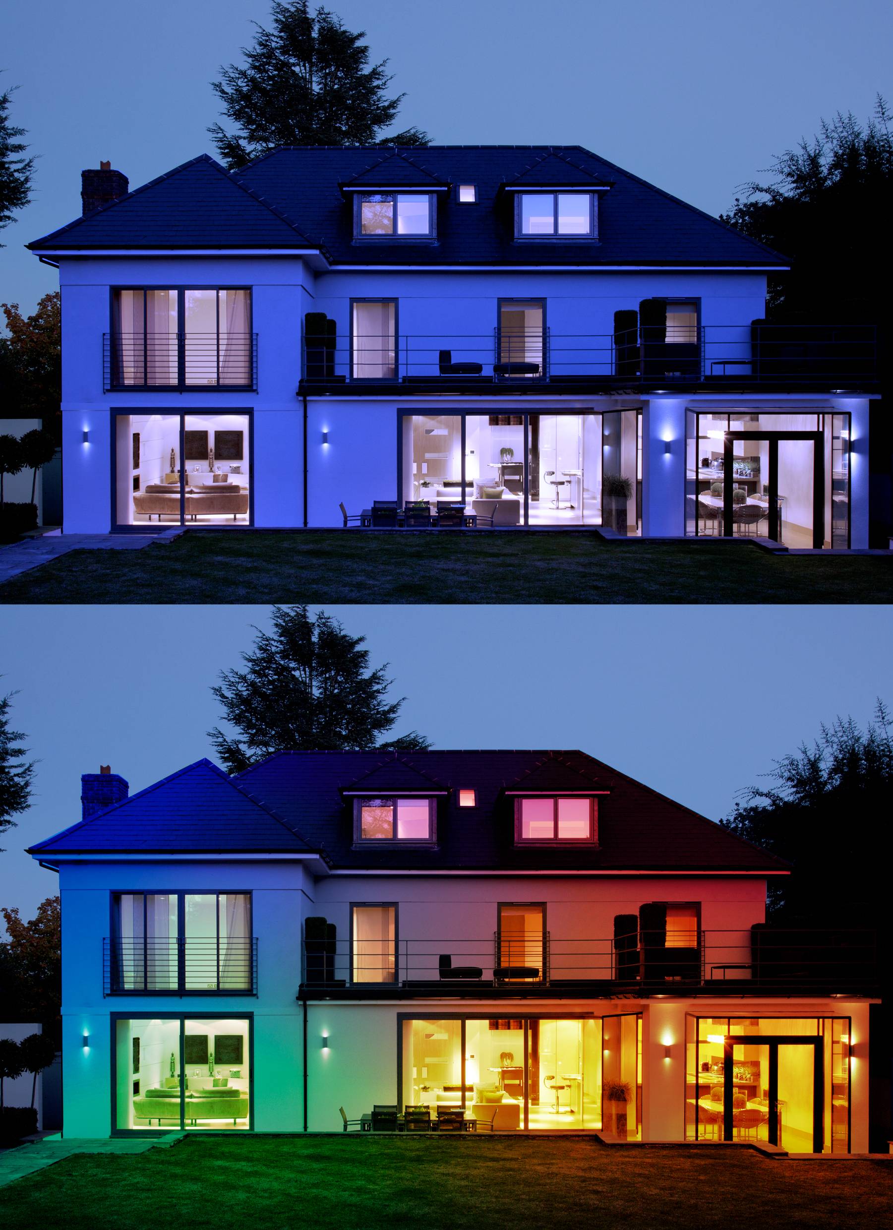 Two-storey house at dusk, illuminated with blue light on the upper floor, and multi-coloured lighting on the lower floor. Modern design with expansive windows.