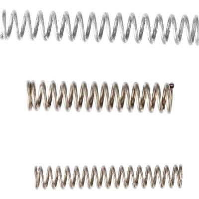 Four different spiral springs in various colours and materials lie side by side on a white background.