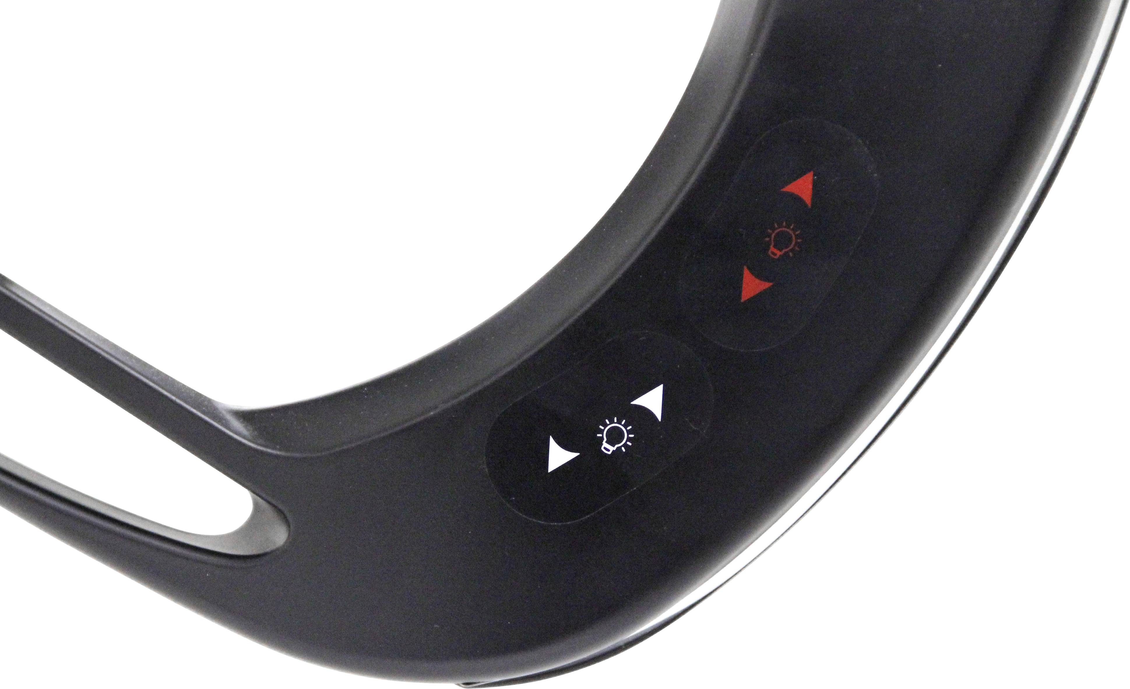 A black LED light ring with two buttons: one with red triangles and the other with white triangles, for brightness adjustment.