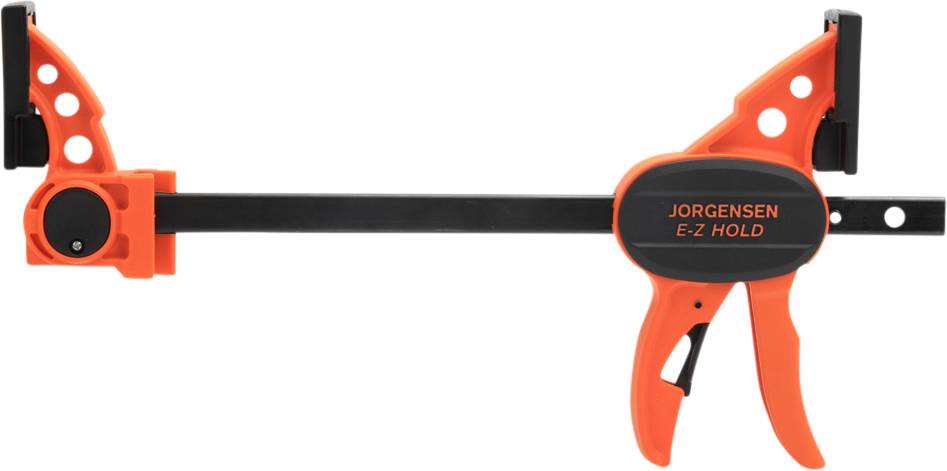 An orange quick-release G-clamp with 'Jorgensen E-Z Hold' printed on the handle. Primarily used for gripping workpieces.
