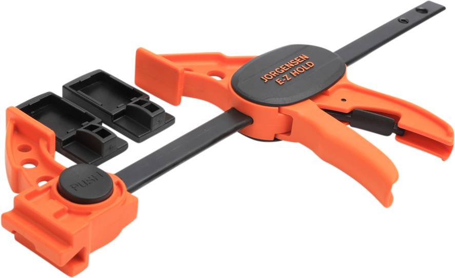 An orange Jorgensen EZ-Hold G-clamp with removable end pieces, used for securing and gripping workpieces.