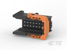 A black and orange electronic component housing, shown from an angle.
