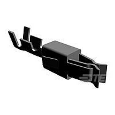 A dark, rectangular plastic plug with multiple connections in a close-up view. The background is out of focus.