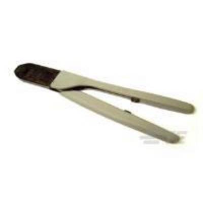 'Close-up of a pair of barbecue tongs with black tips, used for gripping food.'
