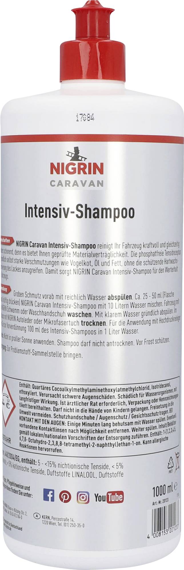 Bottle of Nigrin Caravan Intensive Shampoo, 1000 ml. Red screw cap, application instructions and ingredients listed on the reverse side.