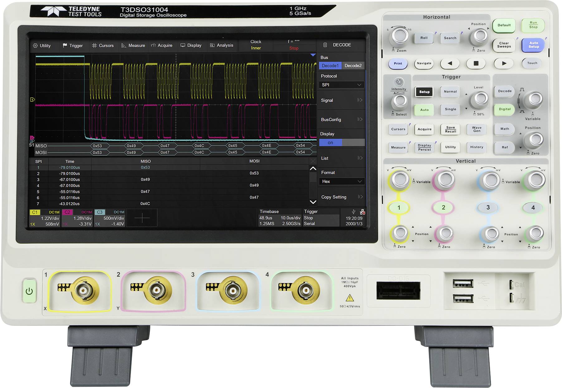 Digital oscilloscope with colourful display. Shows waveform signals and measurement parameters. Four yellow input ports at the bottom.