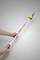 A person is holding a long, silver rod with yellow and red handles. 'POWER QUALITY 400' is written on the rod.