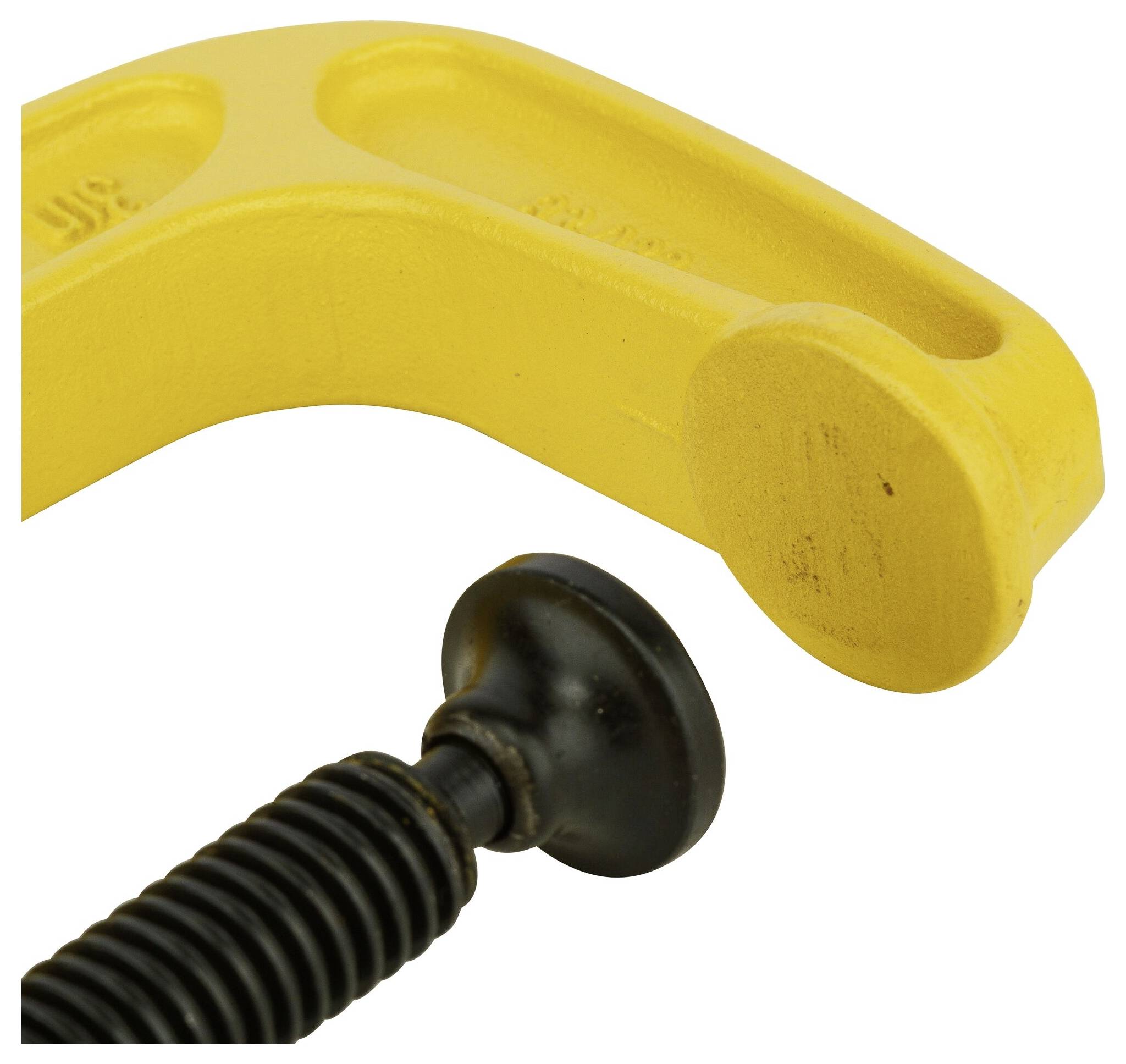 Close-up of a yellow G-clamp arm with a black spindle. Construction tool for securing workpieces.
