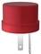 Red cylindrical adapter with two metal pins, suitable for electrical connection.