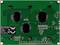 A green electrical component with various circuits and a black CE logo. Three black circles are situated above it.