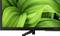 A television with a screen displaying an image of lush green leaves, conveying a sense of nature.